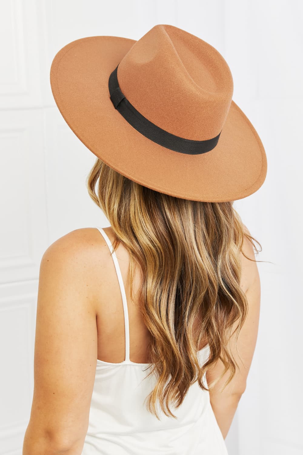 Fame Enjoy The Simple Things tan fedora hat with black ribbon band on woman with long hair